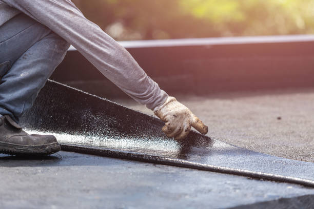 Professional Basement Waterproofing technician working in Sterling, KS